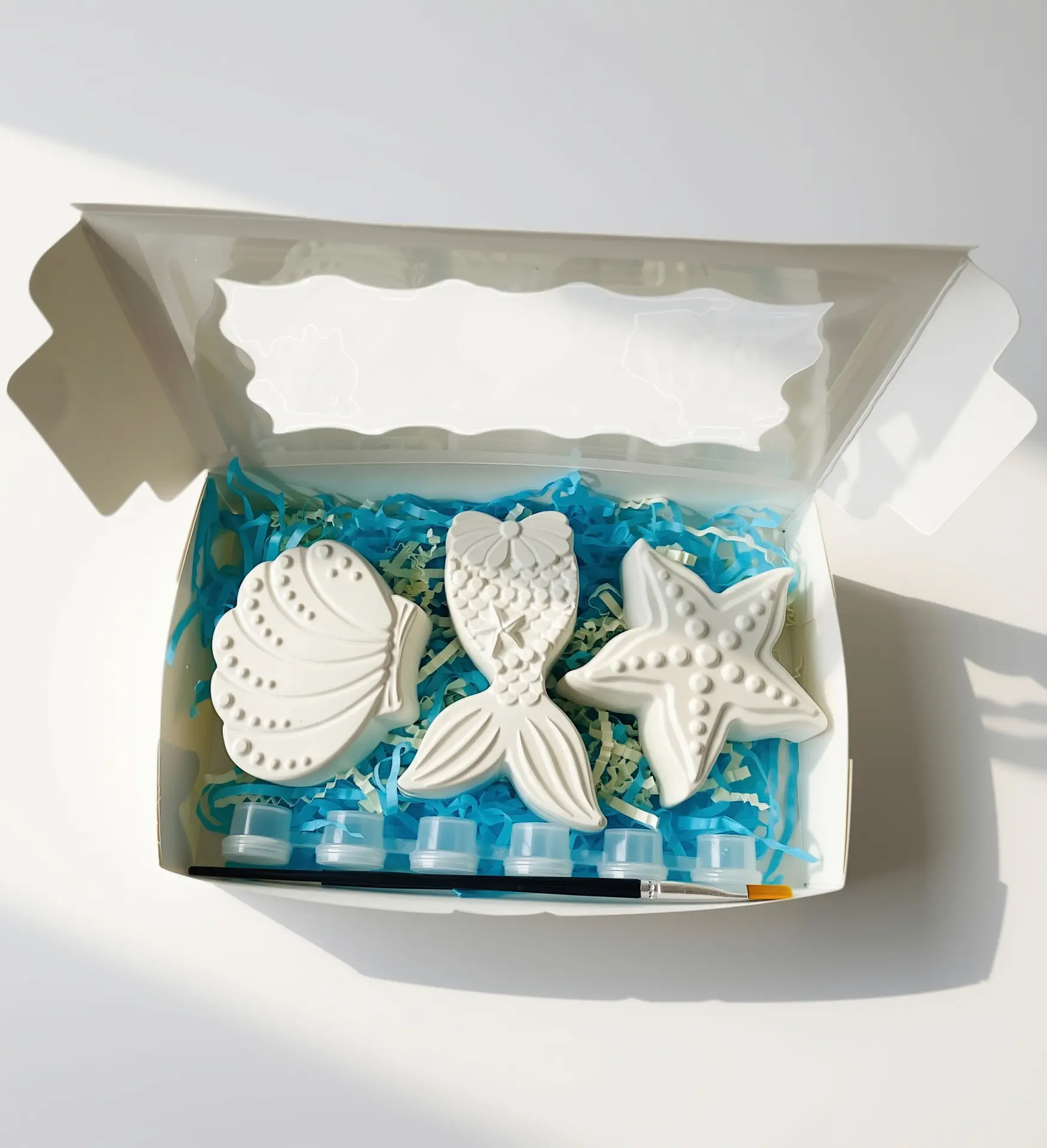 Mermaid Cove plaster painting kit with mermaid tail, shell and starfish pieces