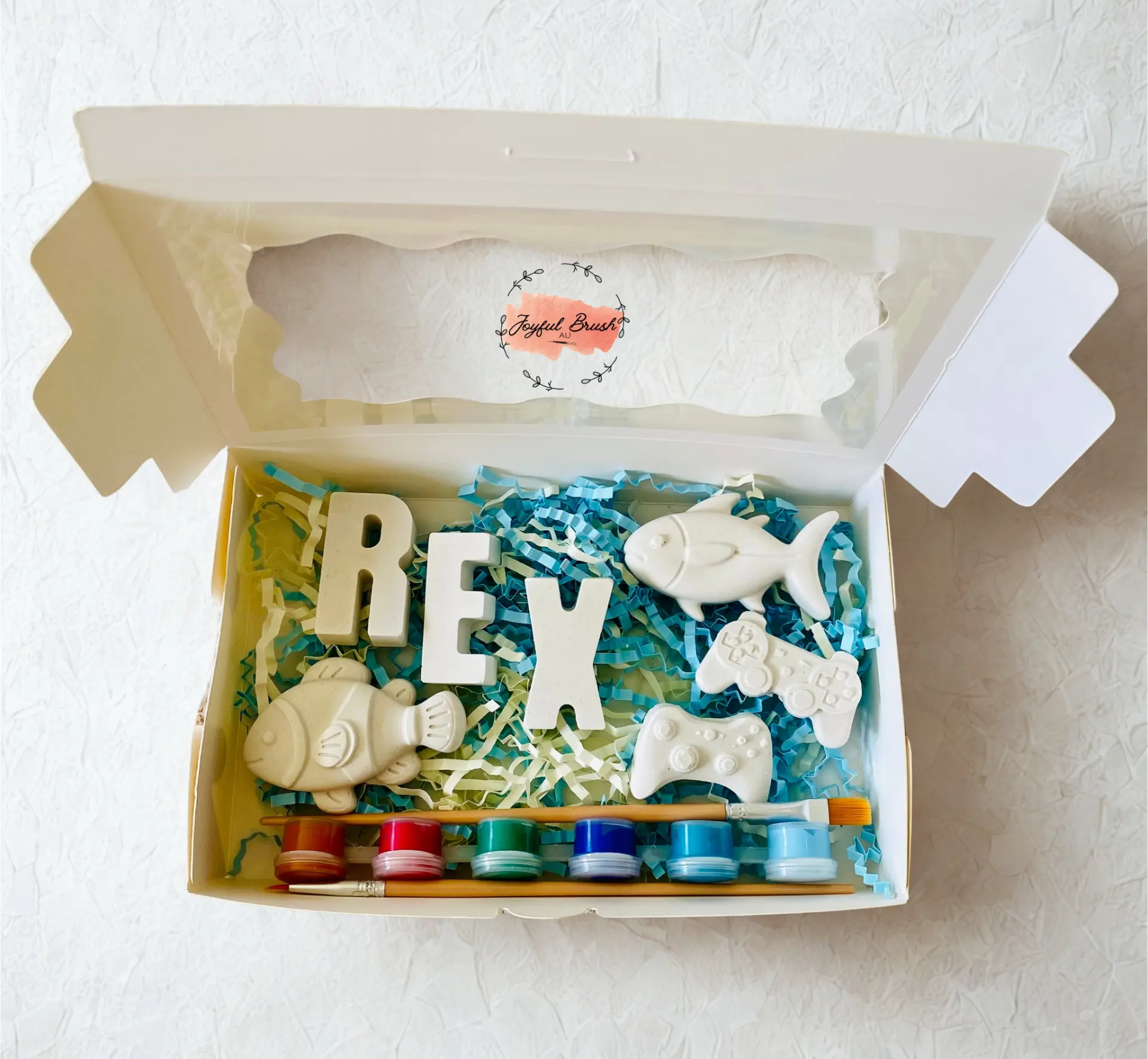 Personalised Rex plaster painting box with themed pieces, paints and brushes